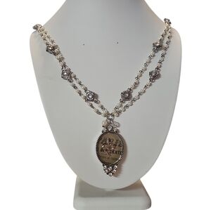 Elegant Silver and Pearl Medallion Necklace